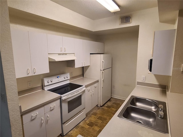 kitchen featuring white cabinetry, white appliances, and sink