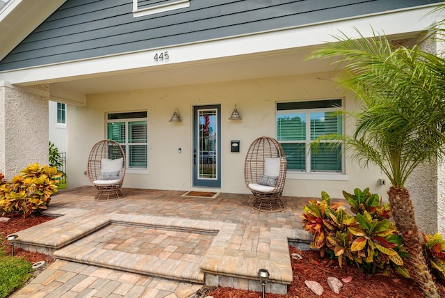 doorway to property featuring a patio