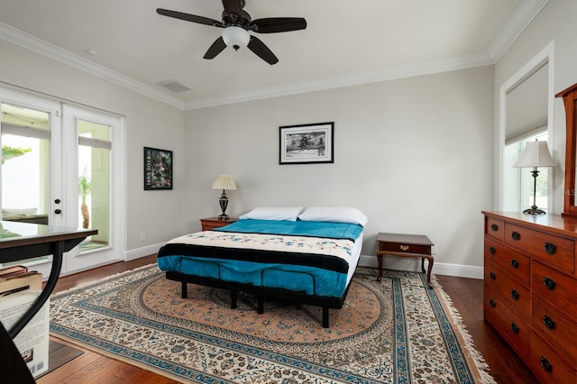 bedroom featuring crown molding, dark hardwood / wood-style floors, and ceiling fan