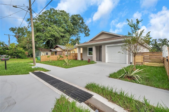 view of front facade with a garage and a front lawn