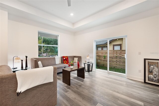 living room featuring light wood-type flooring and a wealth of natural light