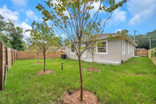 view of yard with central AC unit