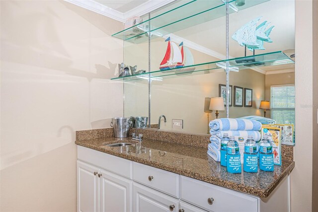 interior space featuring crown molding and vanity