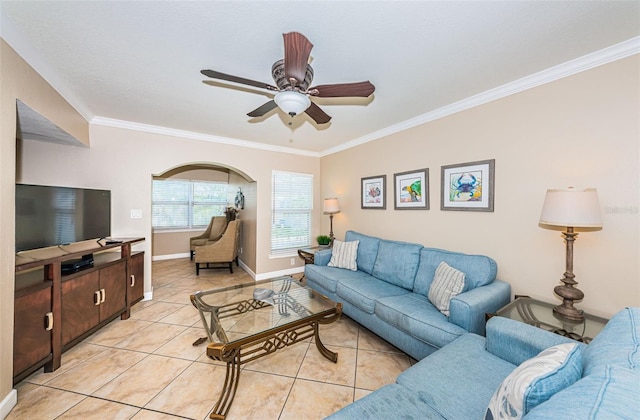 tiled living room featuring ceiling fan and crown molding