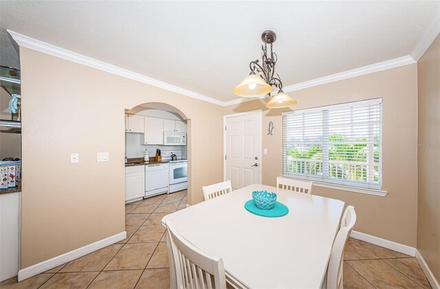 tiled dining space with ornamental molding