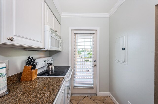 kitchen featuring dark stone counters, white cabinetry, range with electric stovetop, and crown molding