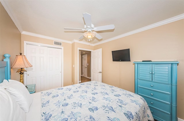 bedroom with ceiling fan, a closet, and ornamental molding