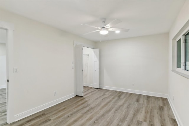 unfurnished bedroom with light hardwood / wood-style floors and ceiling fan