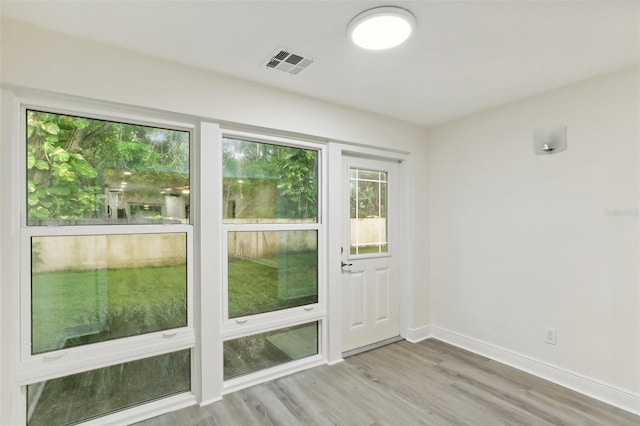 doorway to outside featuring light hardwood / wood-style flooring