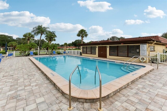 view of swimming pool with a patio area