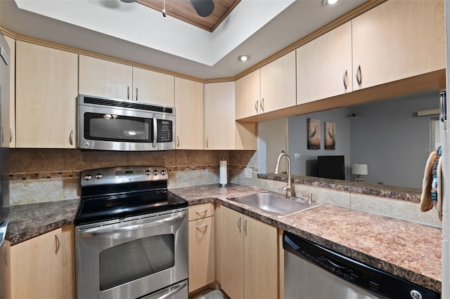 kitchen featuring light brown cabinets, appliances with stainless steel finishes, tasteful backsplash, and sink