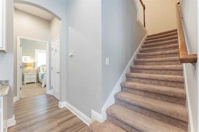 stairway featuring hardwood / wood-style flooring