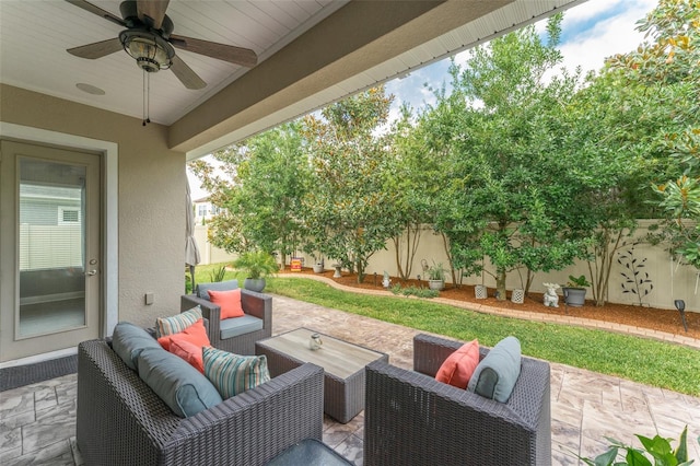 view of patio / terrace with ceiling fan and an outdoor living space