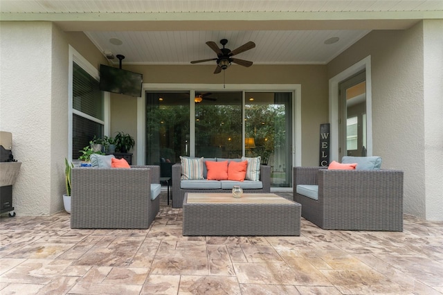 view of patio / terrace featuring ceiling fan and an outdoor living space