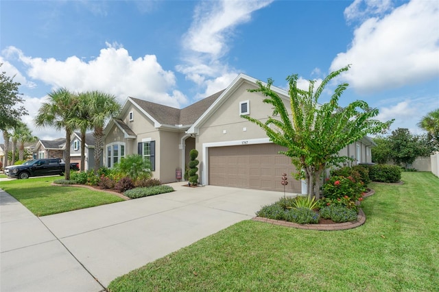 view of front of home featuring a garage and a front lawn