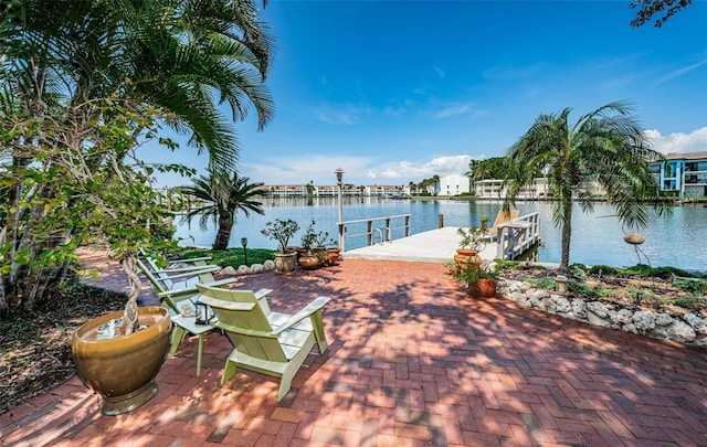 exterior space featuring a dock and a water view