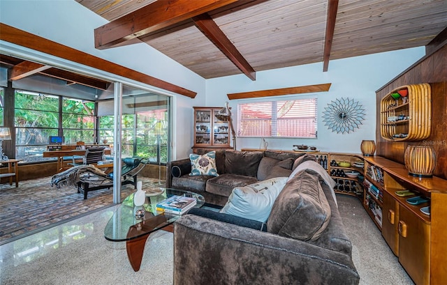 carpeted living room with vaulted ceiling with beams, plenty of natural light, and wooden ceiling