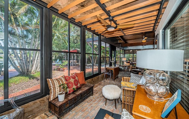 sunroom featuring ceiling fan