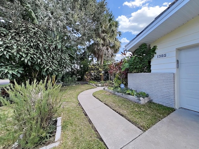 view of yard featuring a garage