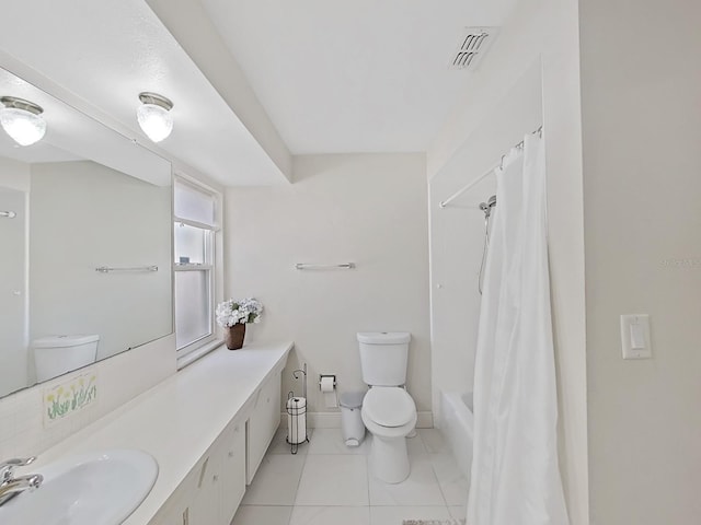 full bathroom featuring shower / bath combination with curtain, vanity, tile patterned flooring, and toilet