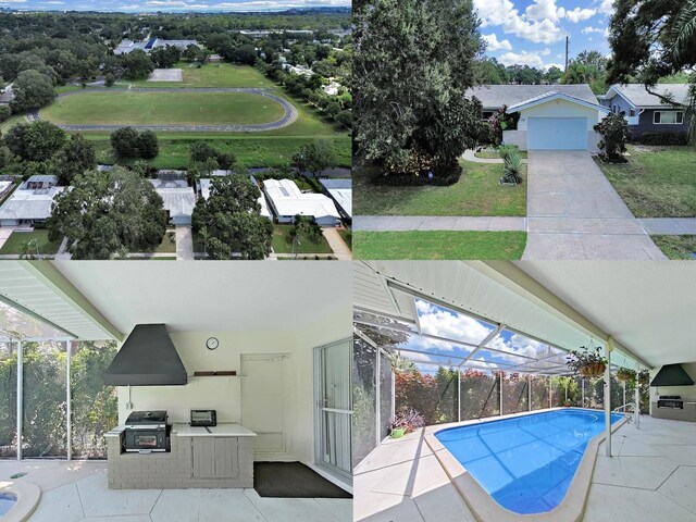 view of swimming pool featuring an outdoor kitchen, a patio area, an outdoor structure, grilling area, and a yard