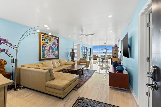 living room featuring a ceiling fan, recessed lighting, visible vents, and baseboards