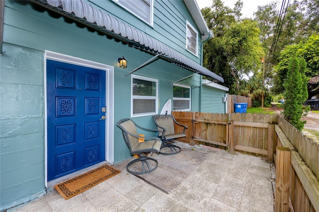 doorway to property with a patio area