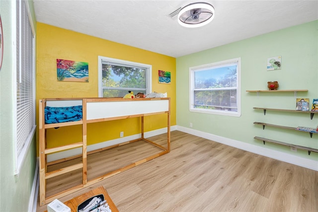 6619 Livingston Ave N, Saint Petersburg, FL 33702 - bedroom featuring baseboards and wood finished floors