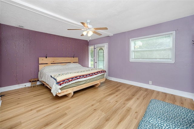 6619 Livingston Ave N, Saint Petersburg, FL 33702 - bedroom featuring baseboards, visible vents, wood finished floors, and a ceiling fan