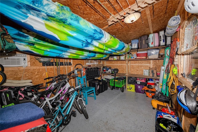 storage room featuring a wall mounted air conditioner