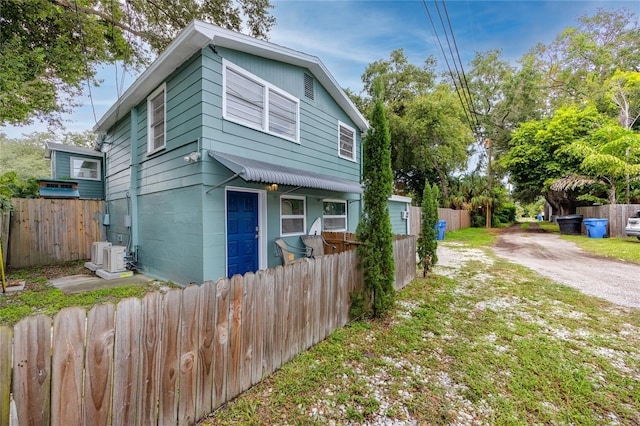 view of front of home with ac unit