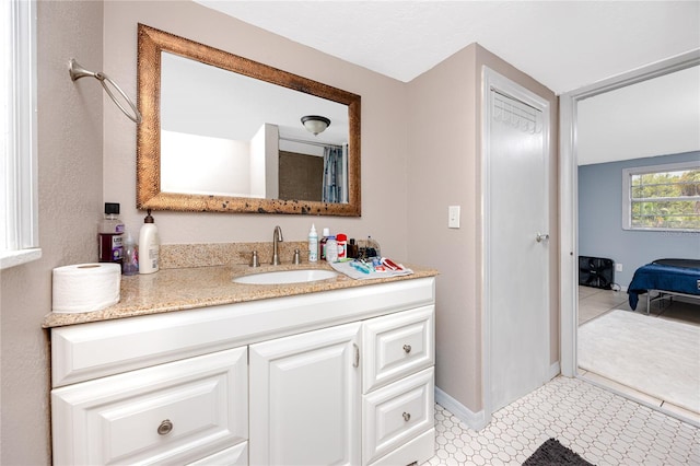 bathroom with tile patterned flooring and vanity