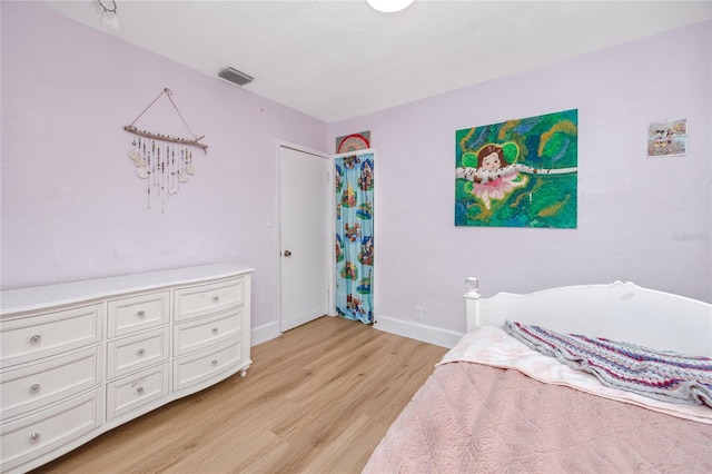 bedroom featuring light hardwood / wood-style flooring