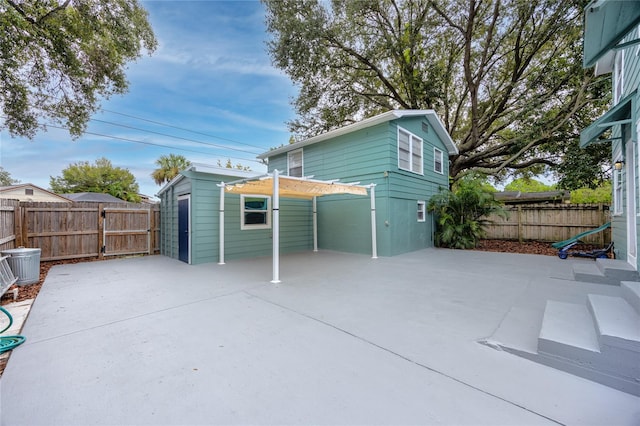 view of patio / terrace with a storage unit