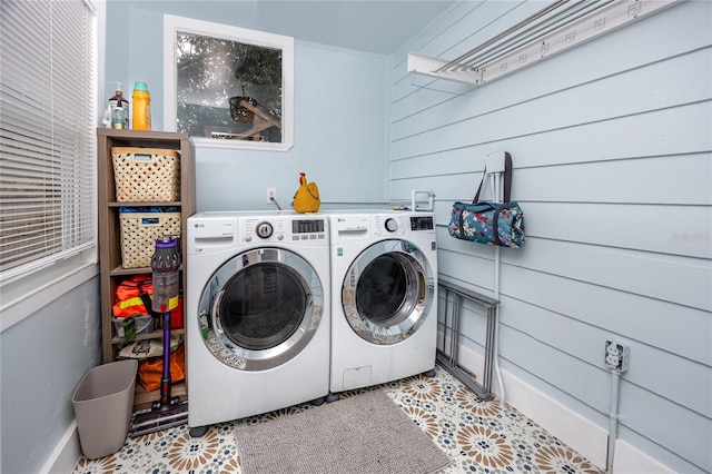 6619 Livingston Ave N, Saint Petersburg, FL 33702 - washroom featuring tile patterned flooring, washer and clothes dryer, and laundry area