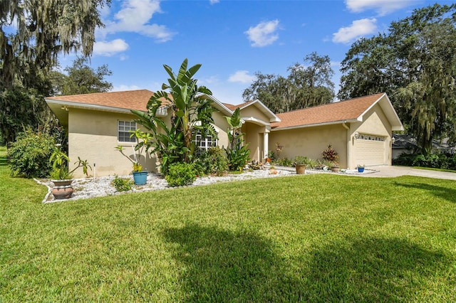 ranch-style house featuring a front yard and a garage