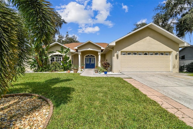 ranch-style home with a front yard and a garage