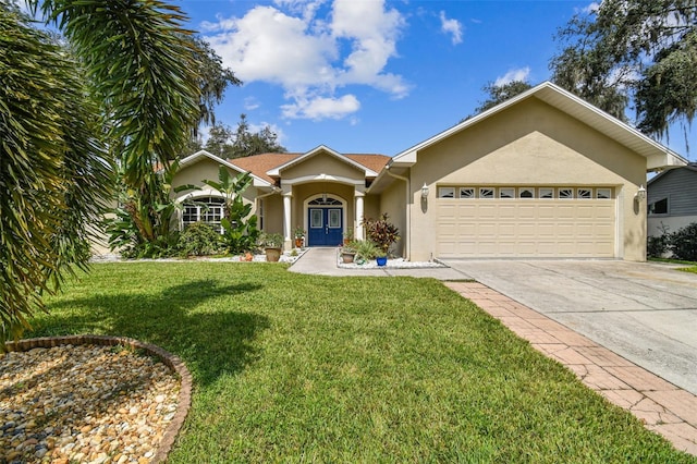 single story home with stucco siding, an attached garage, concrete driveway, and a front yard