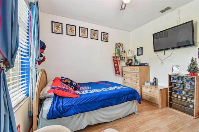 bedroom featuring ceiling fan and light hardwood / wood-style floors