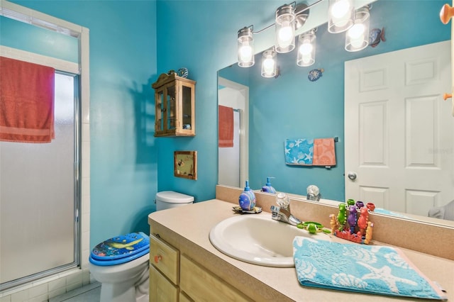 bathroom featuring vanity, toilet, and a shower stall