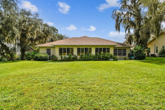 ranch-style home with a front yard