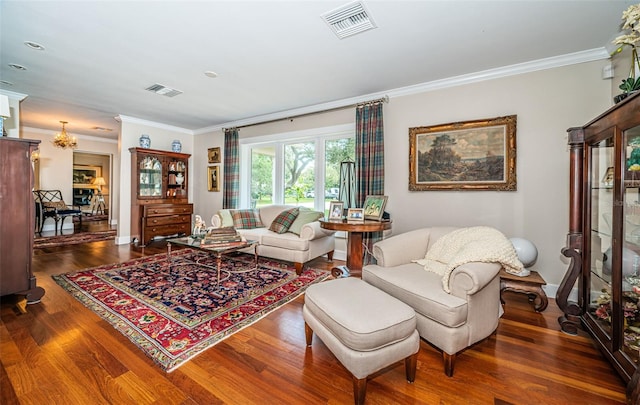 living room featuring dark hardwood / wood-style floors and ornamental molding