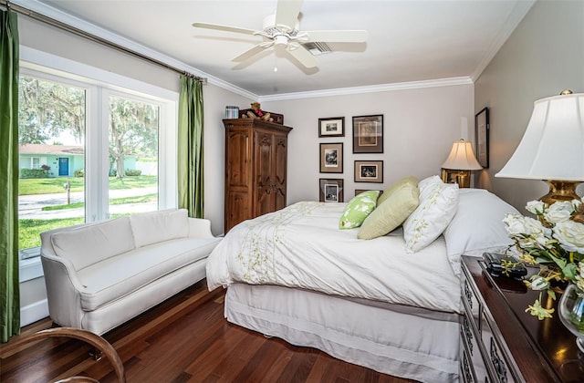 bedroom with ceiling fan, dark hardwood / wood-style floors, and crown molding