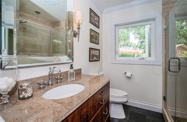 bathroom with toilet, tile patterned flooring, ornamental molding, vanity, and a shower with door