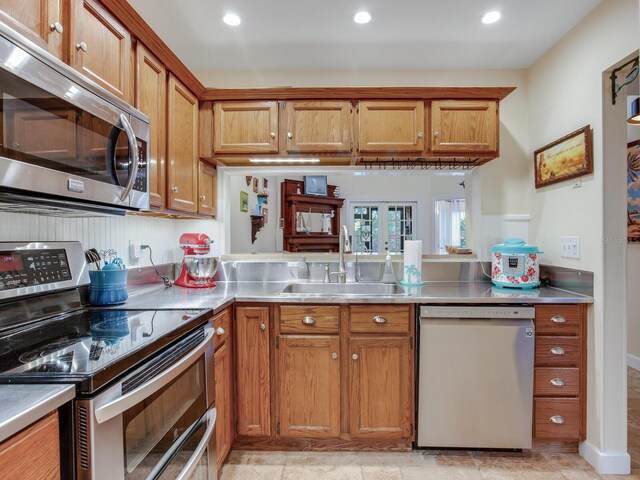 kitchen with appliances with stainless steel finishes and sink