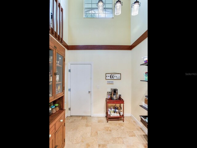 foyer featuring a high ceiling