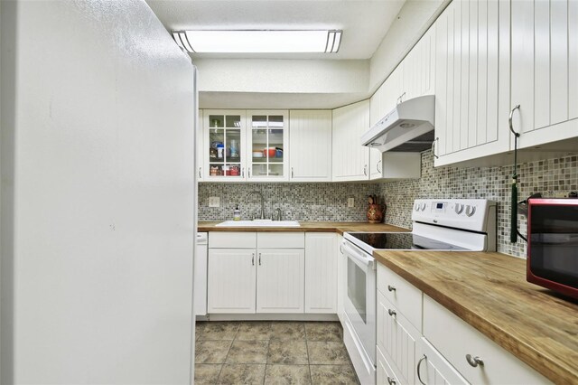 kitchen featuring white electric range, sink, wooden counters, and tasteful backsplash