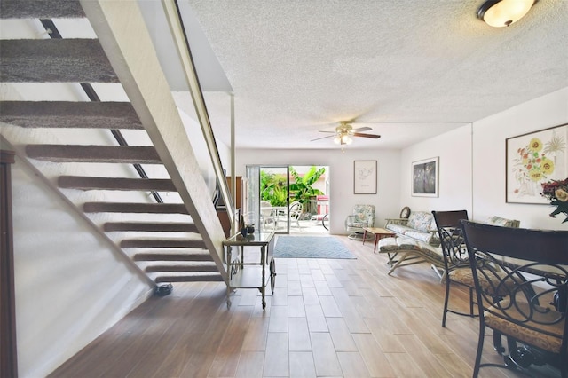 1655 58th Ter S Unit 1, Saint Petersburg, FL 33712 - interior space featuring a textured ceiling, ceiling fan, and wood finished floors