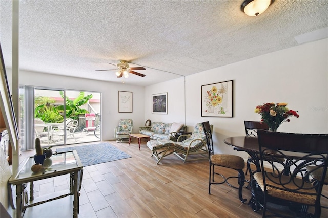 1655 58th Ter S Unit 1, Saint Petersburg, FL 33712 - living room with wood finished floors, ceiling fan, and a textured ceiling