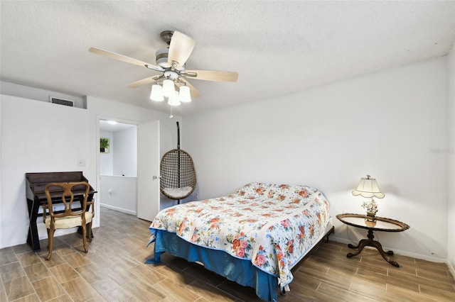 1655 58th Ter S Unit 1, Saint Petersburg, FL 33712 - bedroom featuring baseboards, visible vents, a textured ceiling, and wood finish floors